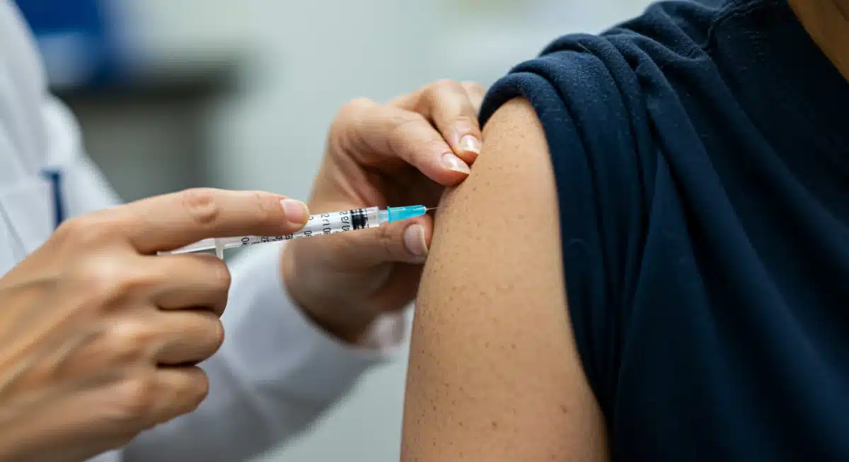 Healthcare professional administering flu vaccine